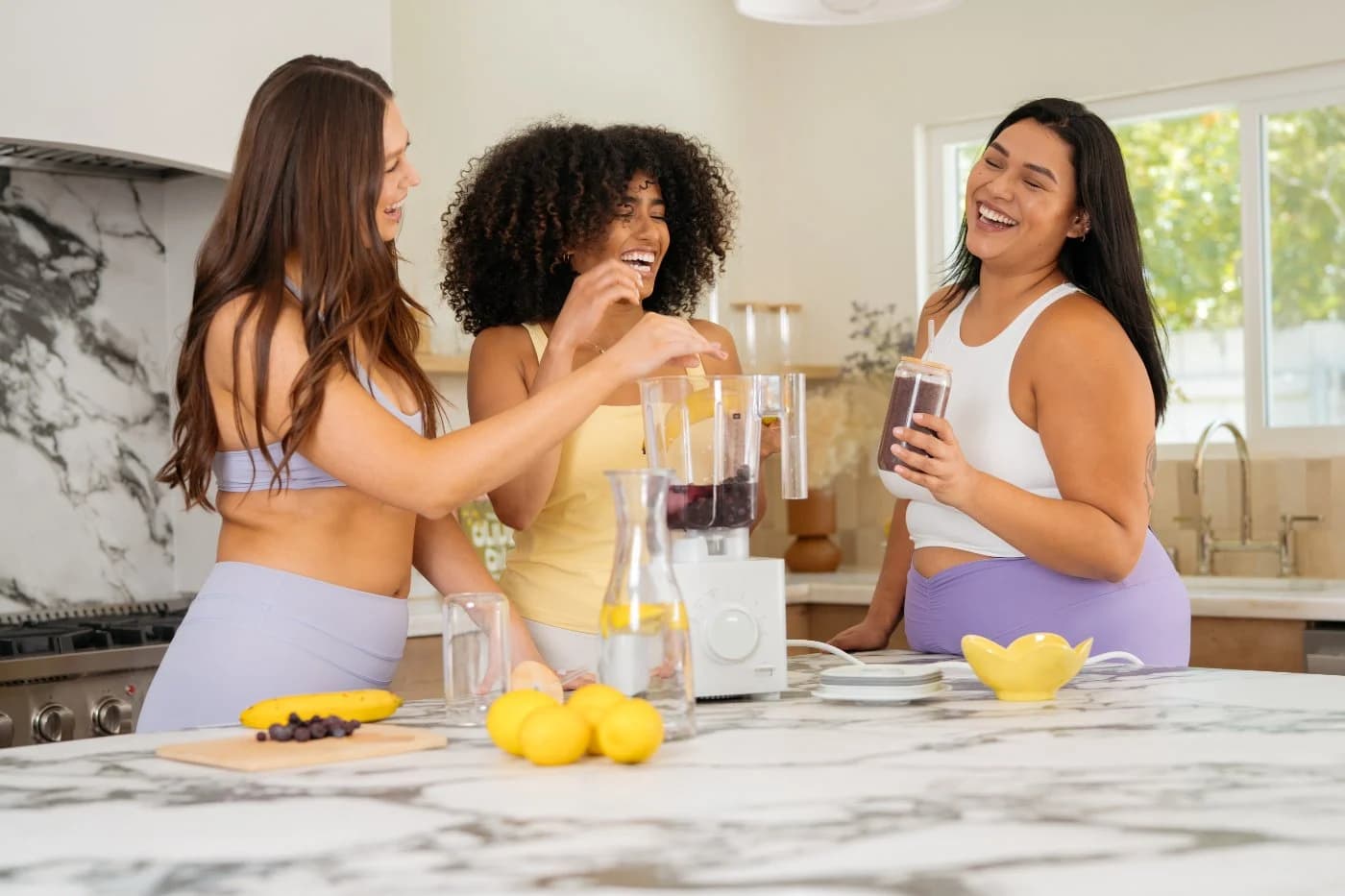 Three Brello members making smoothies together